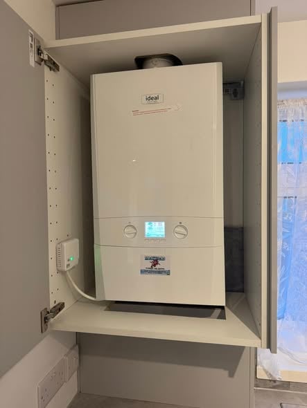 Ideal combi boiler installed inside cabinet